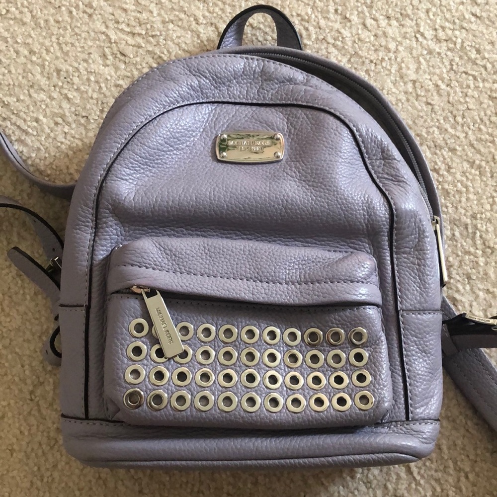 purple micheal kors mini backpack